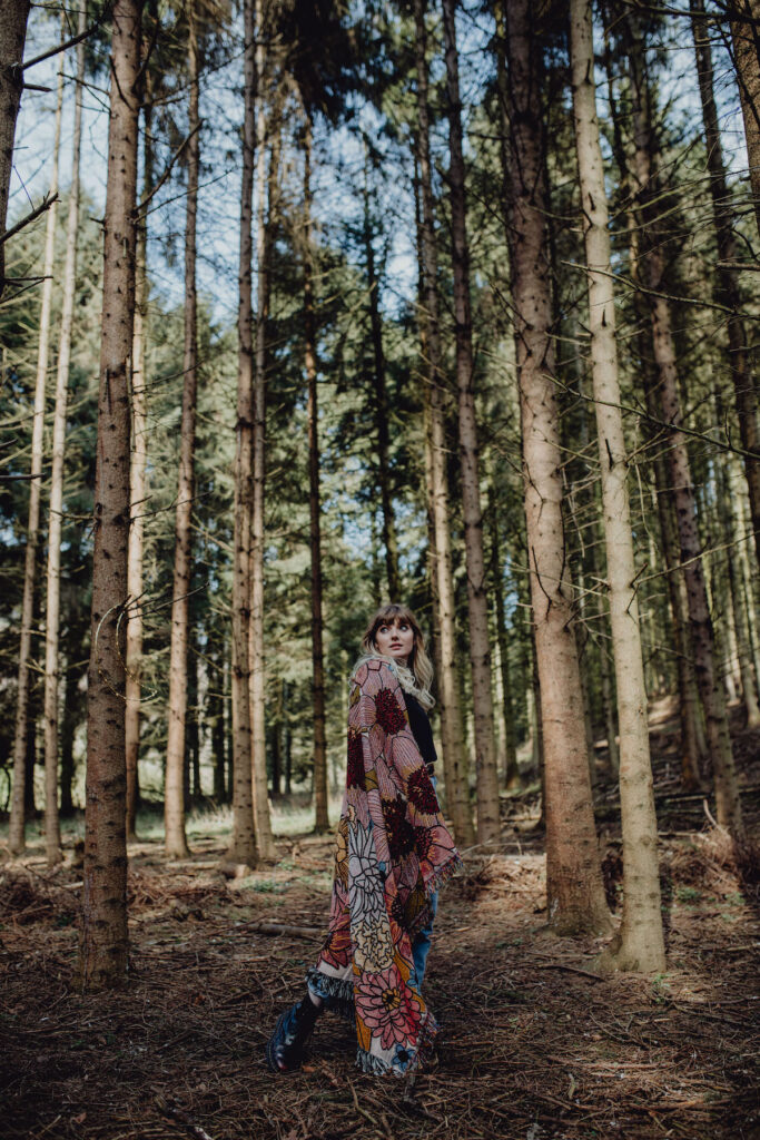 Jemma Johnson stood in woodland