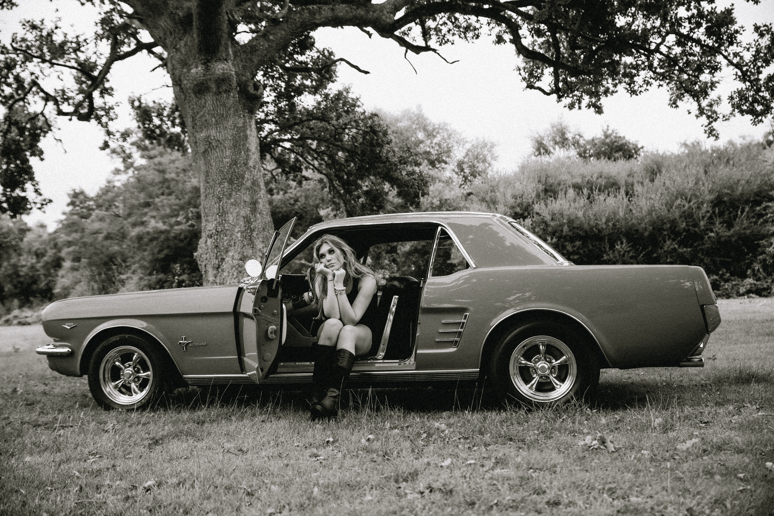 Ria Hanley sitting in a classic car